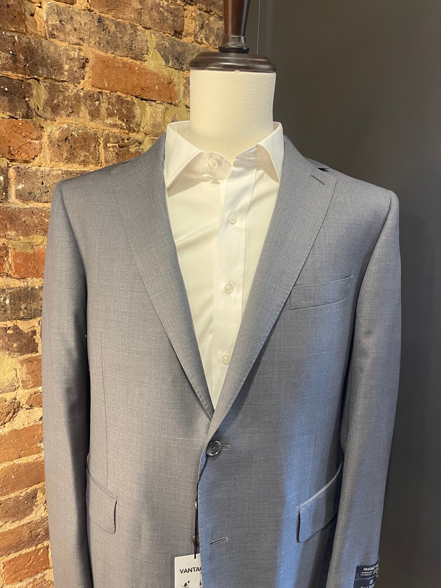 Paul Betenly sharkskin blue suit.